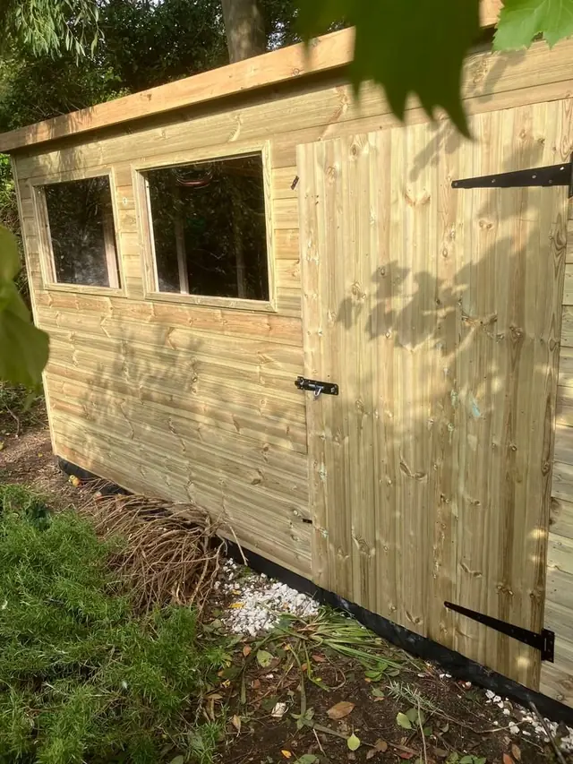 Pent shed with windows
