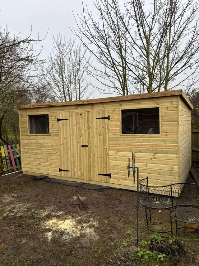 Pent shed with windows