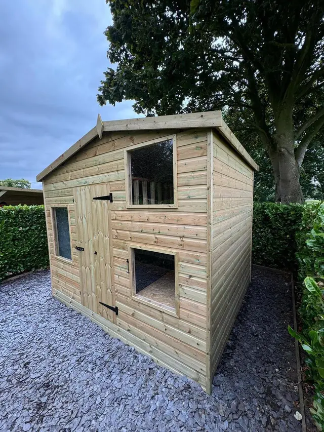 Apex shed with windows on a gravel base