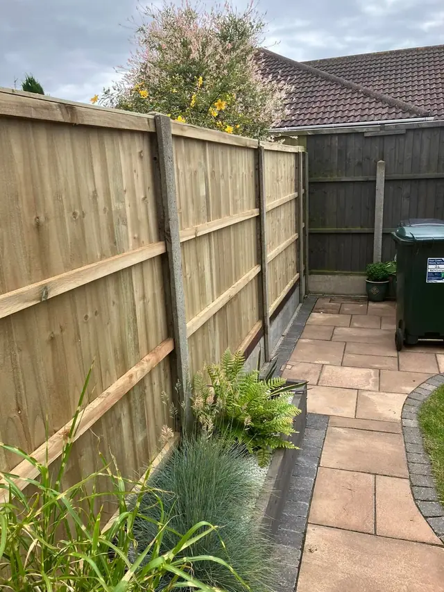Fencing beside a garden path