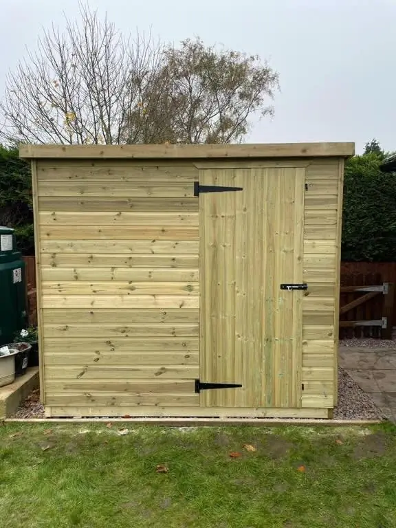 Pent shed with ledged door