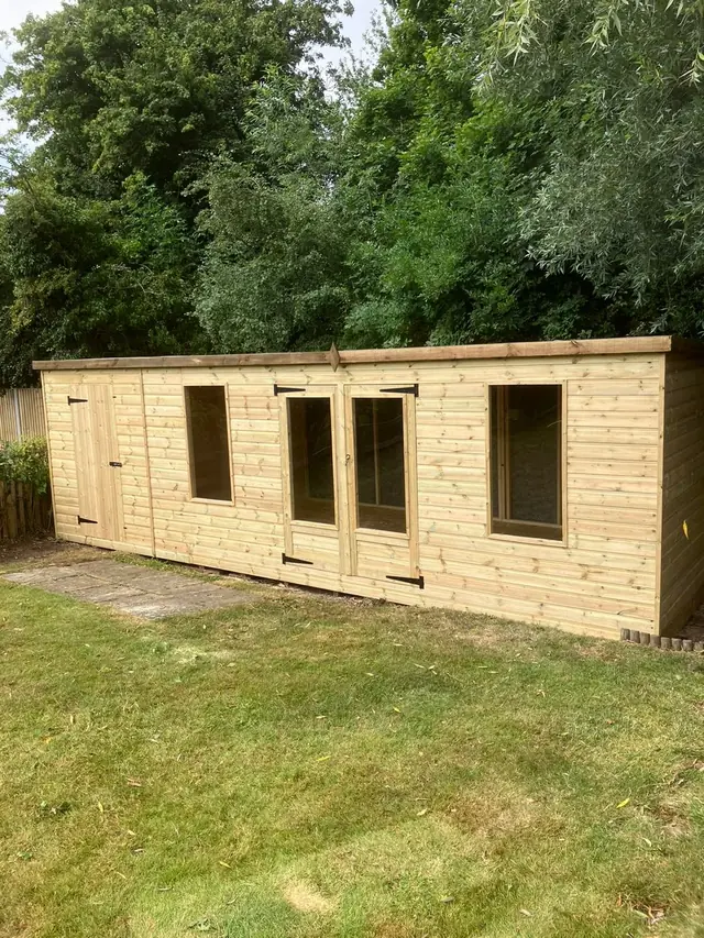 Long garden room with windows and double doors