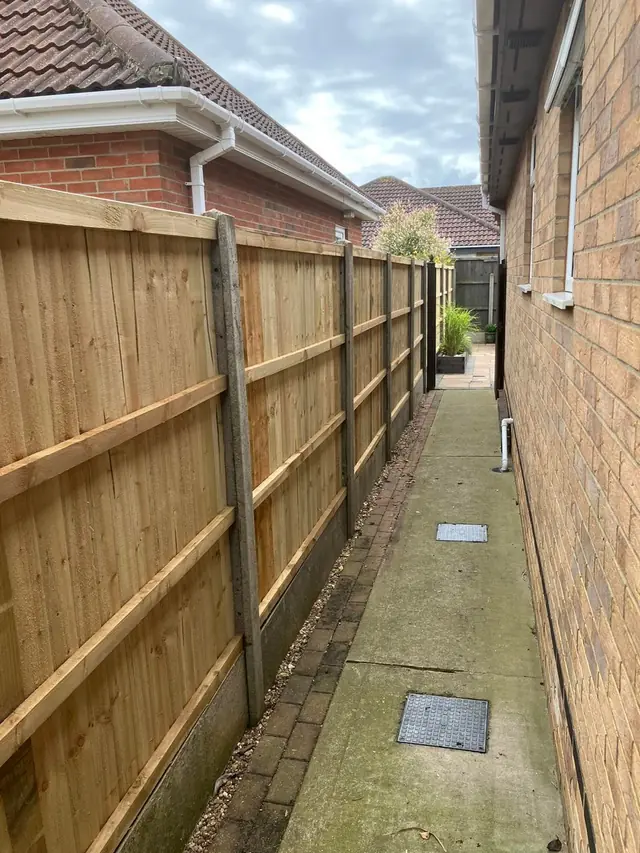 Fencing along the side of a house