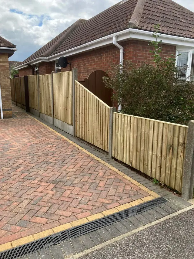 Driveway fencing on a block-paved drive